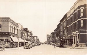 J74/ Hastings Nebraska RPPC Postcard c30-50s Street Scene Stores 395