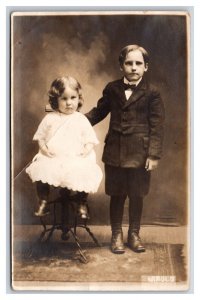 RPPC Adorable Little Boy and Girl Dressed Up Studio View UNP Postcard U4