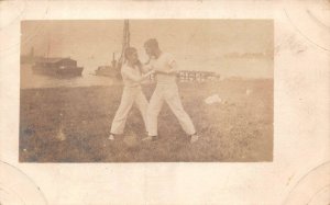 RPPC USS TENNESSEE MILITARY SHIP SAILOR'S PLAY BOXING REAL PHOTO POSTCARD (1915)