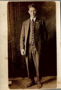 c1910 YOUNG GENTLEMAN NICE SUIT BUT PANTS WAY TO SHORT PHOTO RPPC POSTCARD 38-57