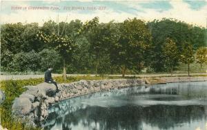 IA, Des Moines, Iowa, Greenwood Park, Man Sitting by water, Enos B. Hunt