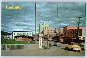 Fairbanks Alaska Postcard First Avenue In Foreground Of Commerce Log Cabin c1960