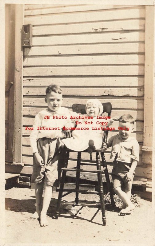 Unknown Location, RPPC, Three Children with a High Chair, Photo