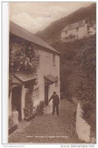 RP: Old Man Climbing Stairs to Rose Cottage, Clovelly, Devon, England