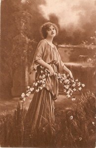 Lady carrying flower branches Old vintage postcard