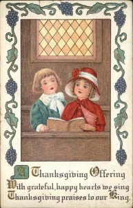 Thanksgiving Little Boy and Girl in Church Grapes Border c1910 Vintage Postcard
