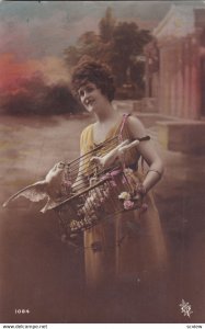 RP;  Woman carrying a cage full of Doves, 1900-10s