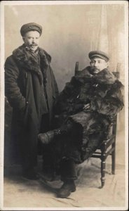 Wealthy Men in Studio Lavish Fur Coats Smoking Pipe c1910 Real Photo Postcard