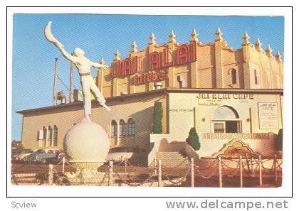 Partial view of the Fronton Palace, and the Jai-Alai Player Statue, Tijuana, ...