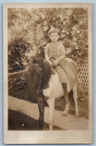 c1910's Little Boy Ride On Pony Flowers RPPC Photo Unposted Antique Postcard