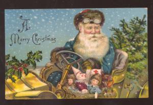 A MERRY CHRISTMAS SANTA CLAUS BLUE ROBE TOYS DRIVING CAR VINTAGE POSTCARD