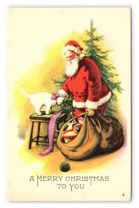 Postcard Santa Claus Red Robe With Bag Of Toys Petting White Cat