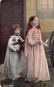 Good Night~young children in nightgowns-holding doll~1910 postcard