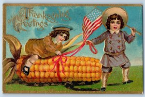 Thanksgiving Postcard Greetings Children Boy On Top Of Big Corn Flag Embosed