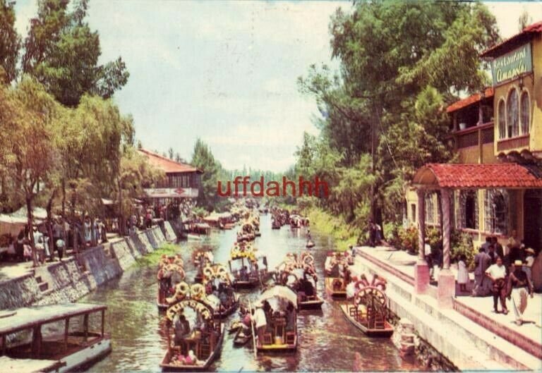 XOCHIMILCO MEXICO WERE (sp) GAYETY, MUSIC AND FLOWER DECORATED CANOES WAIT 1960