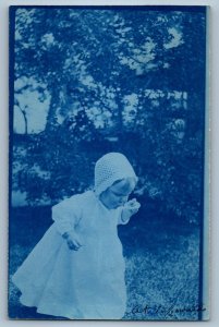 1912 Baby Girl With Crochet Bonnet Trees Scene Denver CO RPPC Photo Postcard
