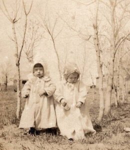 RPPC Most Adorable Children Log Coats Bonnets Trees Real Photo Postcard L23