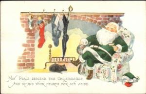 Christmas - Santa Claus in Green Suit by Fireplace c1915 Postcard