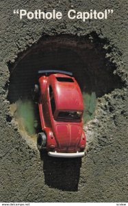 VW Bug in a pothole , 50-60s