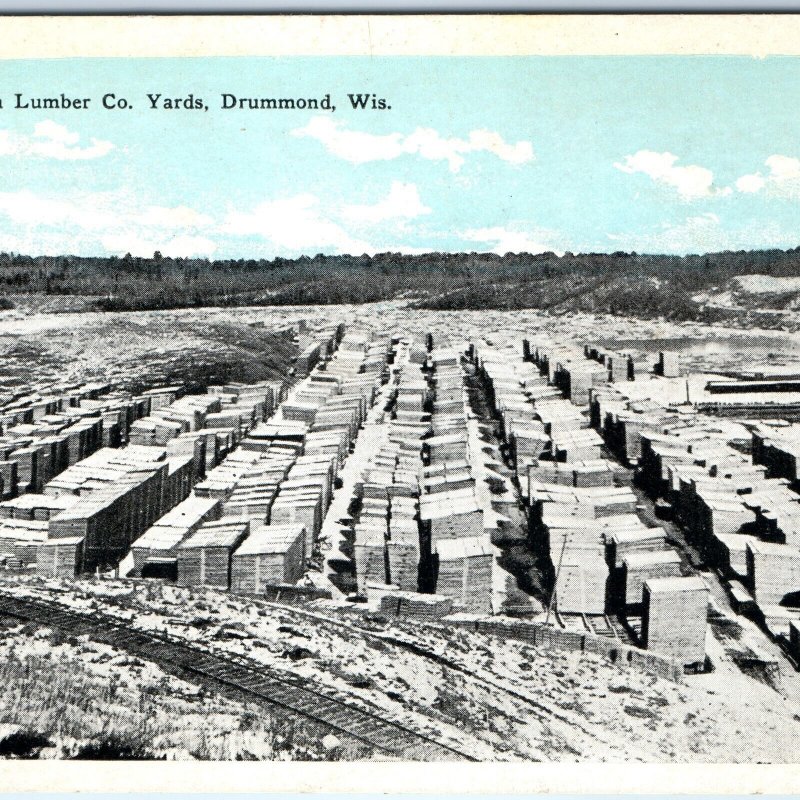 c1910s Drummond, Wis Rust-Owen Lumber Co Lumberyard Railway Postcard WI A169