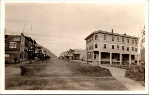 Real Photo Postcard Town View Railroad Train Tracks Street Scene in Alaska