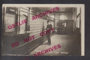 Guymon OKLAHOMA RPPC 1911 INTERIOR POST OFFICE Mail Boxes USPS RFD Mailman OK