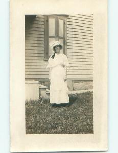 Pre-1918 rppc WOMAN IN BONNET OUTSIDE THE HOUSE r5834
