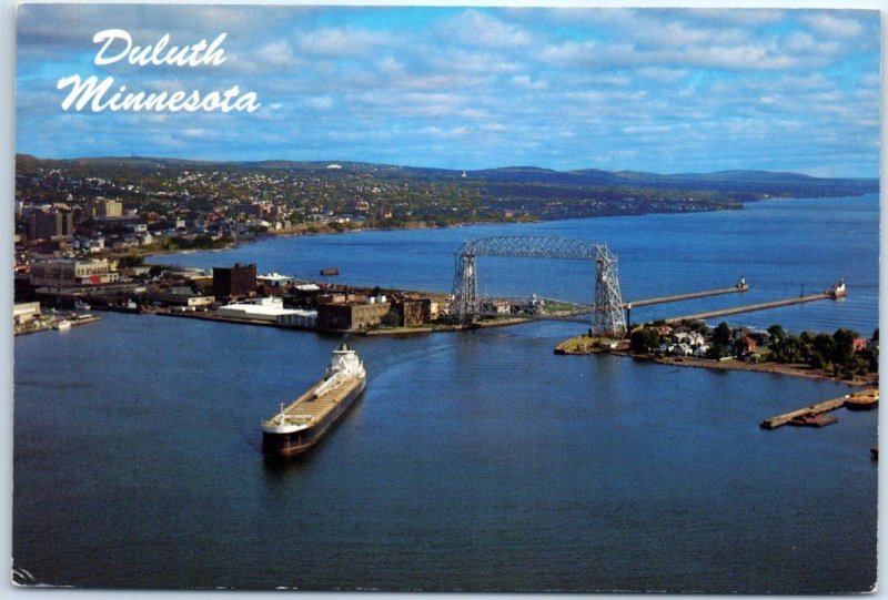 An aerial view of a giant freighter approaching the Duluth Superior Harbor - MN