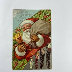 c.1915 Old Santa Claus Bell Toys Sack Bag Stockings Embossed Christmas Postcard