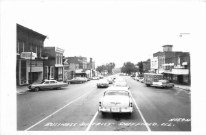 1960s Sheffield Illinois Business District occupation RPPC Postcard 25-11241