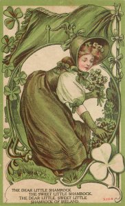 St. Patrick's Day Postcard Woman Picks A Dear Little Sweet Shanmrock Of Ireland