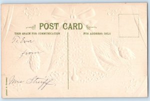 c1910's Merry Christmas Floral Bell Pine Cone Embossed Posted Antique Postcard