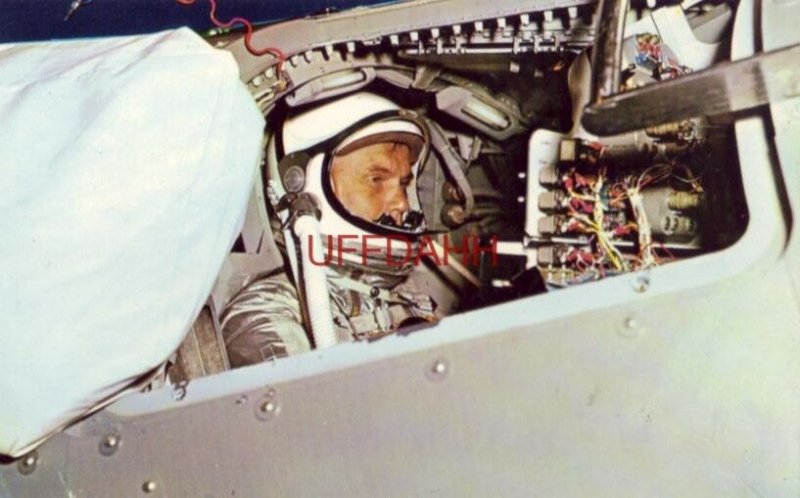 SHOWING JOHN GLENN IN SPACE TRAINING CAPSULE PRIOR TO TRIP INTO SPACE