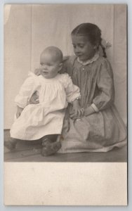RPPC 1900s Children Little Girl Holding on to Baby for Photo Postcard H27