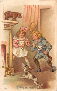 A Bear Hunt children playing with brooms and dog in house antique pc Y14390