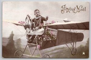 RPPC Christmas Boy Flying Airplane Studio Prop Joyeux Noel Postcard N25