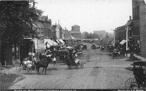 J62/ Columbus Junction Iowa RPPC Postcard c1910 Main Street Stores Fair 99