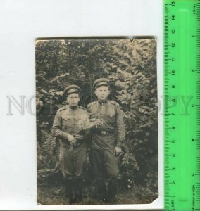 452345 USSR two soldiers in the bushes with flowers Old photo