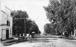 Mondovi WI Dirt Street View H. Berg Feed Barn Horse & Wagons RPPC Postcard