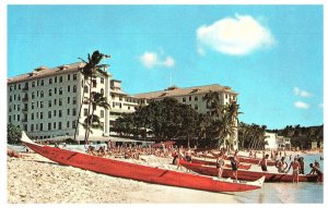 Red Outrigger Canoes Beachside at the Moana Hotel Hawaii Postcard