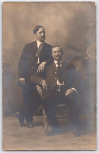 Vintage Sepia Portrait Postcard of Two Men in Early 1900s Attire