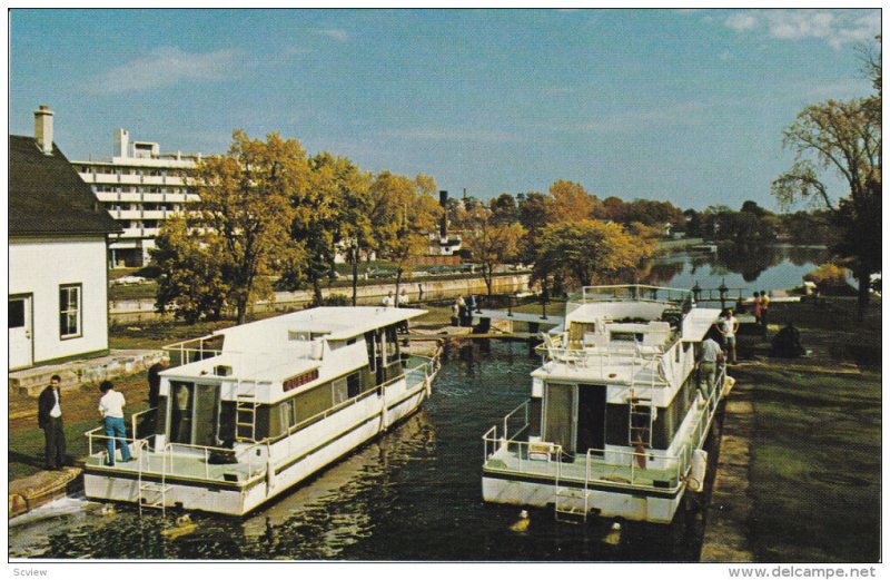 Pleasure craft cruise the picturesque, RIDEAU CANAL system, Ontario, Canada, ...