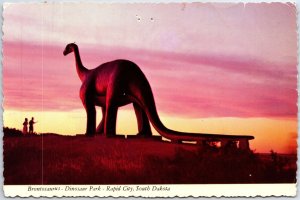 VINTAGE CONTINENTAL SIZE POSTCARD BRONTOSAURUS DINOSAUR PARK RAPID CITY S DAKOTA