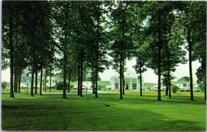 Colonial Motor Lodge - front view through trees