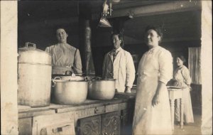 Man & Women in Kitchen Pots Pans Stove Oven c1910 Real Photo Postcard