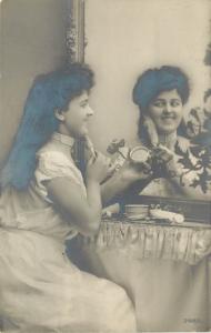 c1910 RPPC Postcard; Brunette Girl Puts on Makeup in Dressing Table Mirror