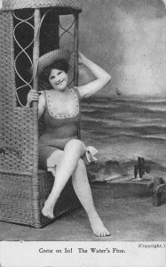 WOMAN IN BATHING SUIT AT BEACH WICKER FURNITURE RISQUE POSTCARD (c. 1910) !!!