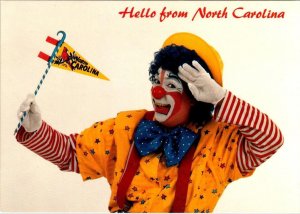 NC, North Carolina HELLO!  Skeata The Clown Holding State Flag  4X6 Postcard