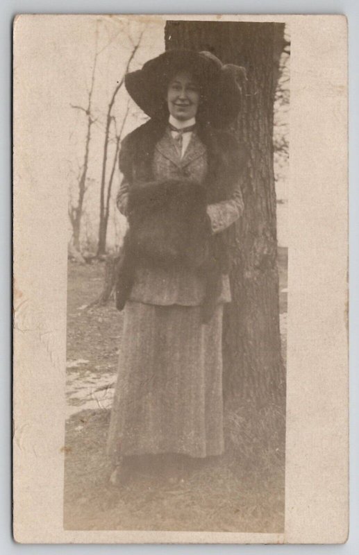 RPPC Pretty Woman with Large Hat and Hand Muff Photo at Tree Postcard H30