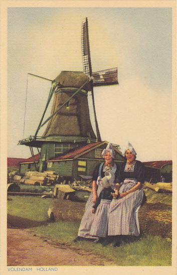 Netherlands Volendam Locals in Traditional Costume with Windmill